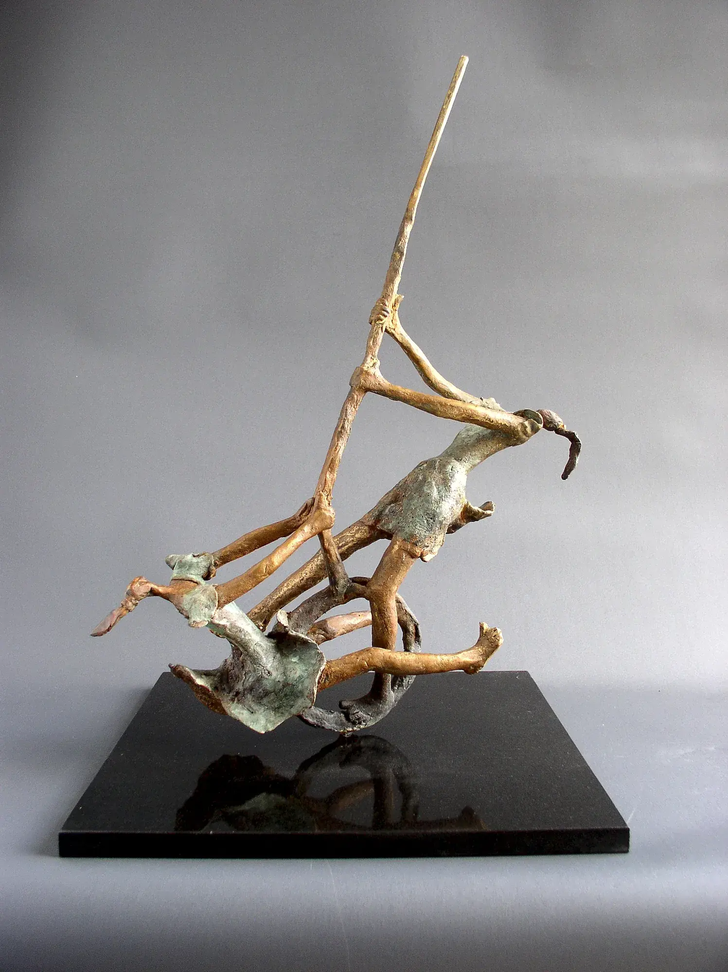 Silent Evenings on the Bank of Sublime — a figure balanced on a curved, wave-textured bronze canoe-shaped base